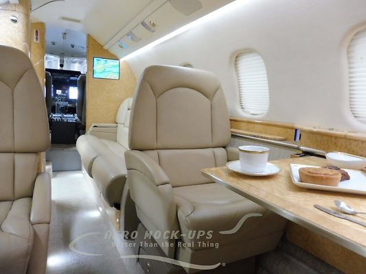 Learjet-60-fwd-club-chairs-sofa-and-cockpit-1030x773-1